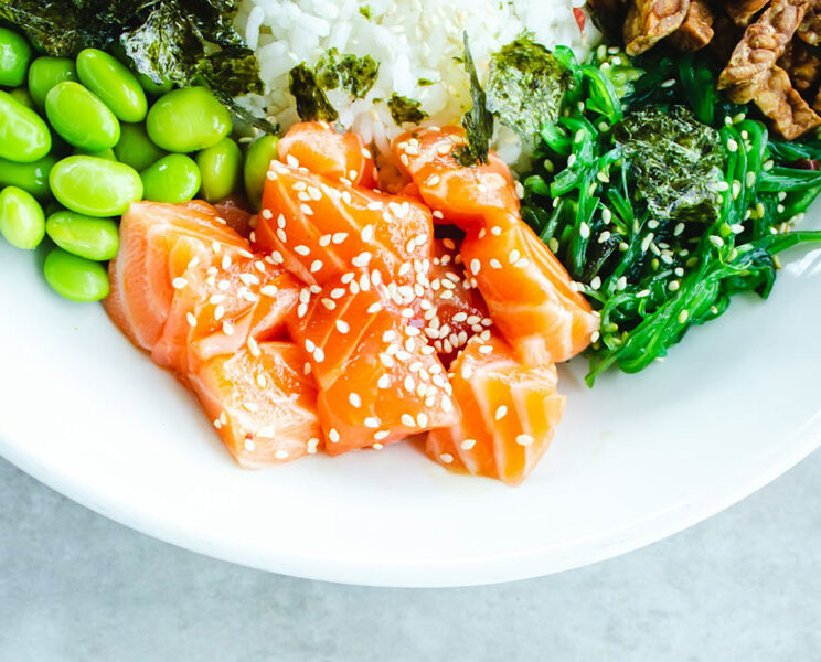 a plate with salmon and vegetables