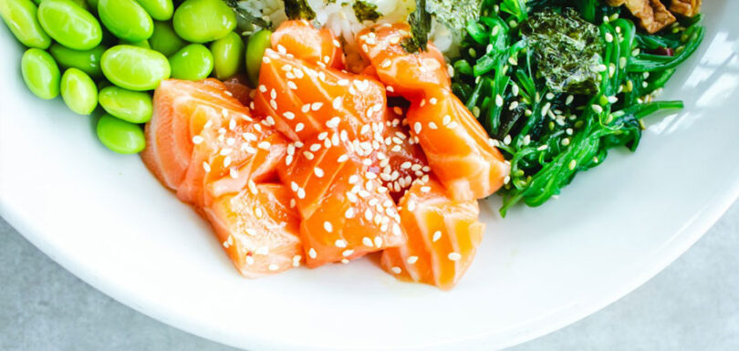 a plate with salmon and vegetables